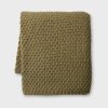 Thick knitted throw in an olive colour way. 140x175cm Acrylic